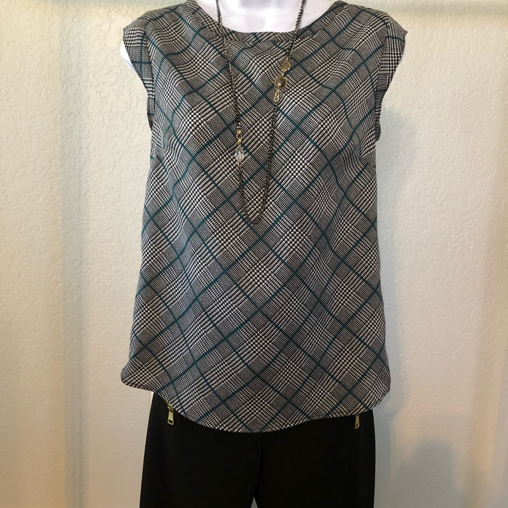 The limited plaid capped sleeve blouse